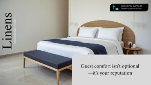 White hotel bed with navy throw blanket and premium linens supplied by YOB Hotel Supplies Bhutan