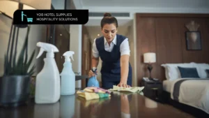 Housekeeper using essential cleaning products for housekeeping in a hotel room