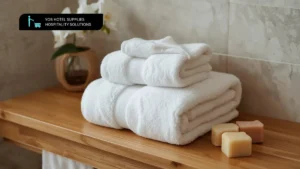 Stack of plush hotel towels neatly folded in a luxury hotel bathroom setting
